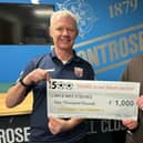 Club chief executive Peter Stuart presents the cheque to Bruce Steeves.