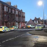The area around the Keptie Street flat was cordoned off for six hours while negotiators tried to convince the man to leave the building. (Wallace Ferrier)