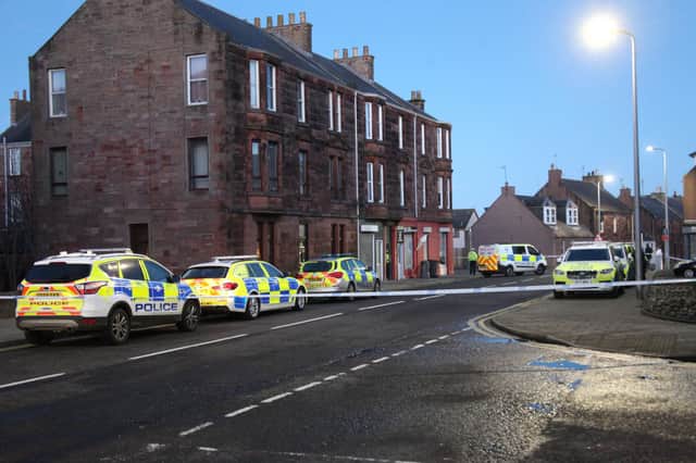 The area around the Keptie Street flat was cordoned off for six hours while negotiators tried to convince the man to leave the building. (Wallace Ferrier)