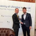 ​Mr Gethins presents the Angus Council tie at the Ukraine embassy.