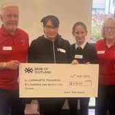 The girls presented their cheque at a recent Carnoustie Memories meeting to ​Craig Murray and Lorraine Young.