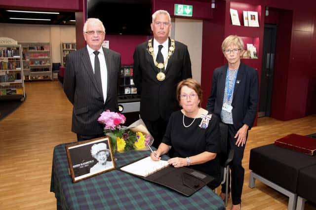 Pictured signing the book are the Lord Lieutenant (seated), Sandy McKendrick, Provost Brian Boyd, and Margo Williamson.​​​​​​​​​​​​​​​​​​​​​​​​​​​​​​​​​​​​​​​​​​​​​​​​​​​​​​​​​​​​​​​​​​​​​​​​​​​​​​​​​​​​​​​​​​​​​​​​​​​​​​​​​​​​​​​​​​​​​​​​​​​​​​​​​​​​​​​​​​​​​​​​​​​​​​​​​​ (W Ferrier)