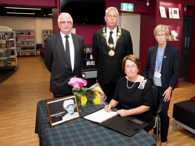 Pictured signing the book are the Lord Lieutenant (seated), Sandy McKendrick, Provost Brian Boyd, and Margo Williamson.​​​​​​​​​​​​​​​​​​​​​​​​​​​​​​​​​​​​​​​​​​​​​​​​​​​​​​​​​​​​​​​​​​​​​​​​​​​​​​​​​​​​​​​​​​​​​​​​​​​​​​​​​​​​​​​​​​​​​​​​​​​​​​​​​​​​​​​​​​​​​​​​​​​​​​​​​​ (W Ferrier)