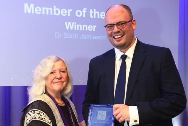 Dr Scott Jamieson receives his award at the ceremony.