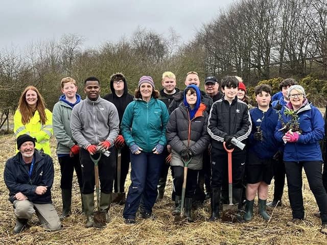 Some of the young people from Brechin High School who took part in the tree planting are pictured with Lesley Lindsay from Scotia Homes (yellow jacket), Fiona Lawrence, Brechin High School Head Teacher (front row green jacket) and Lil Black (blue jacket front row), Brechin High School Rural Studies and volunteers.