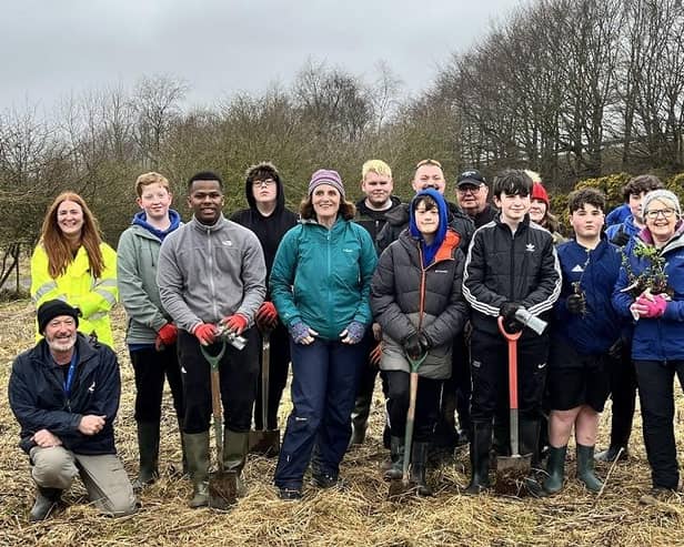 Some of the young people from Brechin High School who took part in the tree planting are pictured with Lesley Lindsay from Scotia Homes (yellow jacket), Fiona Lawrence, Brechin High School Head Teacher (front row green jacket) and Lil Black (blue jacket front row), Brechin High School Rural Studies and volunteers.