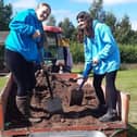 ​Volunteers get stuck in to help get the reserve’s zip wire project off the ground.