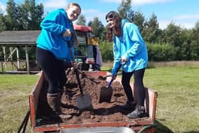 ​Volunteers get stuck in to help get the reserve’s zip wire project off the ground.
