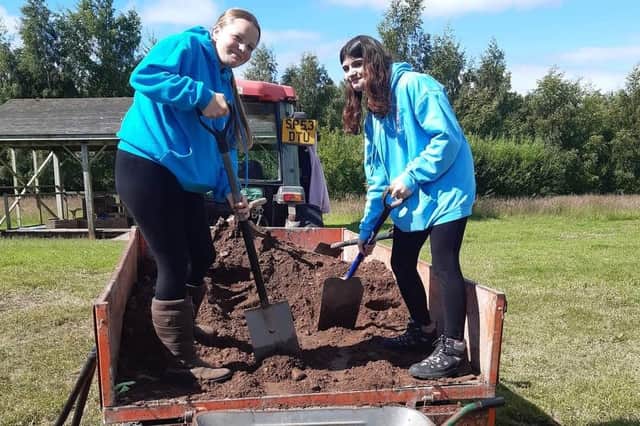 Volunteers get stuck in to help get the reserve’s zip wire project off the ground.