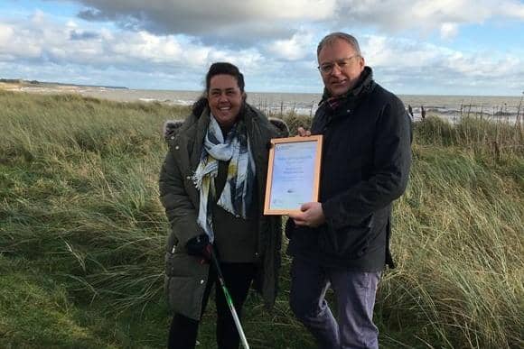 Carnoustie resident Rhona Hunter receives her award from Barry Fisher, Keep Scotland Beautiful CEO.