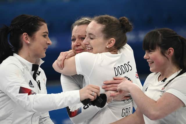 Eve Muirhead, Vicky Wright, Jennifer Dodds and Hailey Duff celebrate after Britain win the women's gold medal game of the Beijing 2022 Winter Olympic Games. Photo by Jeff Pachoud/AFP via Getty Images