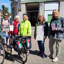 ​The knitters are pictured taking a break during their journey.