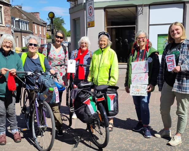 ​The knitters are pictured taking a break during their journey.