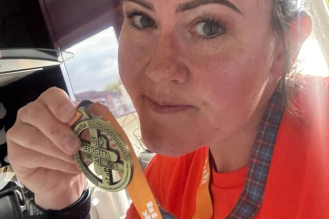 Veronica with her Aberdeen Kiltwalk medal