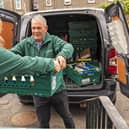 Foodbank volunteers unload food bank donations. Credit: Chris Lacey Photography