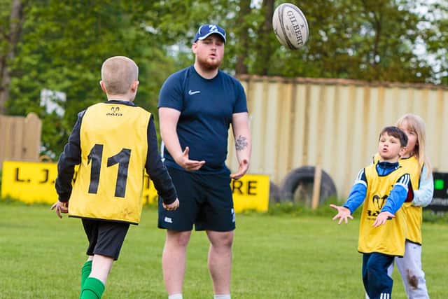 Rugby Academy member Arron Jackson helps coach its award-winning autism-friendly rugby sessions. (Alan S. Morrison)