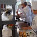 A professional cookery demonstration with students.