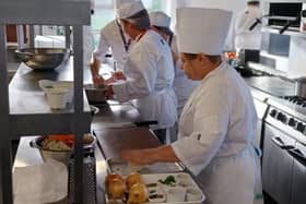 A professional cookery demonstration with students.
