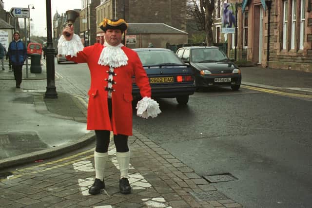 Carnoustie Town Crier, Ian Smart took to the streets in December 2000 to let the residents know that Santa Claus would be coming to town to switch on the town's festive lights. OYEZ he will!