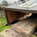 ​The fallen Aberlemno 3 surrounded by the protective box. Concerns had recently been raised about the stability of the structure. (Contributed)