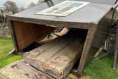 ​The fallen Aberlemno 3 surrounded by the protective box. Concerns had recently been raised about the stability of the structure. (Contributed)