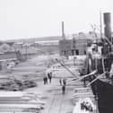 ​A steamship berthed in the Wet Dock in the heyday of the timber trade.