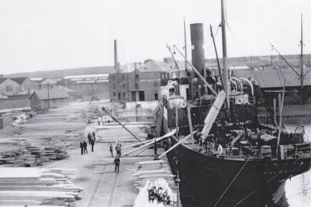 A steamship berthed in the Wet Dock in the heyday of the timber trade.