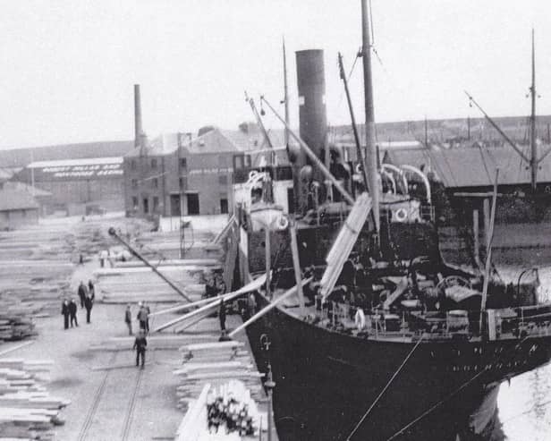 ​A steamship berthed in the Wet Dock in the heyday of the timber trade.