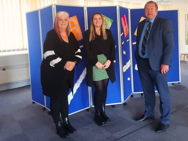 Graeme Dey with staff from the support group.