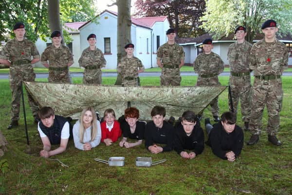 The new recruits are pictured underneath a Bivvy tent at the event. (Wallace Ferrier)