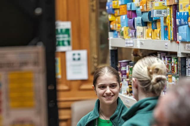 Foodbank volunteers pack emergency food parcels Credit: Chris Lacey Photography