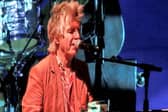 Neil Finn plays piano at the Manchester show.