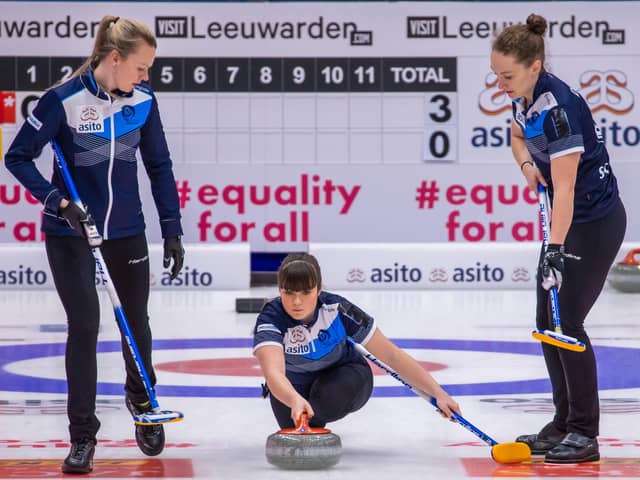 Hailey Duff delivers her stone at the Olympic qualification event in Leeuwarden, guided on the left by Forfar’s Vicky Wright. Pic by WCF / Steve Seixeiro