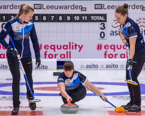 Hailey Duff delivers her stone at the Olympic qualification event in Leeuwarden, guided on the left by Forfar’s Vicky Wright. Pic by WCF / Steve Seixeiro