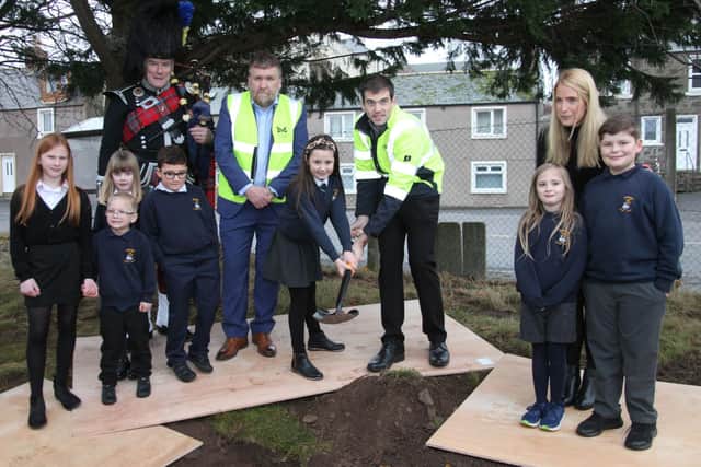 Ferrydean Primary School pupils help plant the time capsule at Montrose Harbour.     Pics: Wallace Ferrier