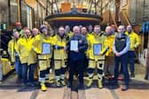 ​Members of the Arbroath crew are pictured at the lifeboat station with their commendation awards.