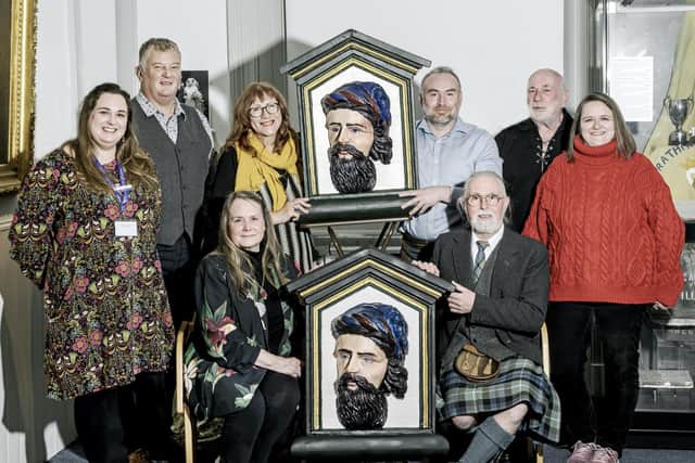 Members of Montrose Burns Club and AngusAlive staff are pictured at the presentation with Julia and Raymond Colla (seated). (Ron Stephen Photography)