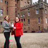 Helen Buchanan, castle general manager, and Kim Cameron from The Gin Bothy with one of the 650 bottles of anniversary gin.