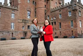 Helen Buchanan, castle general manager, and Kim Cameron from The Gin Bothy with one of the 650 bottles of anniversary gin.