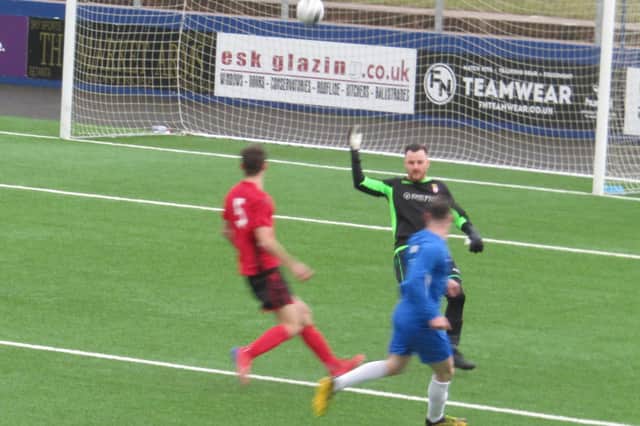 Kieran Thomson lobs the keeper for a Roselea goal. Pic by Graham Douglas