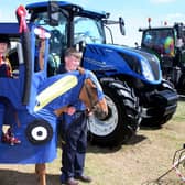 Molly Leith-McGaw with her pony Poppy, dressed as a four-hoof drive tractor, with brother Ritchie.