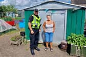 ​PC Ronnie Irvine is pictured with garden co-founder Laura Tierney.