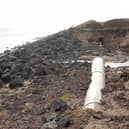 The section of damaged pipe. The site is still being undermined by tide action, and the public are being advised to avoid the area.