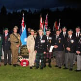 The East of Scotland RMA pictured next to the grave with Australian servicemen. Pic: Wallace Ferrier.