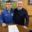 Terry Masson, left, signing a one-year contract extension with Montrose as manager Stewart Petrie looks on (Pic: Montrose FC)