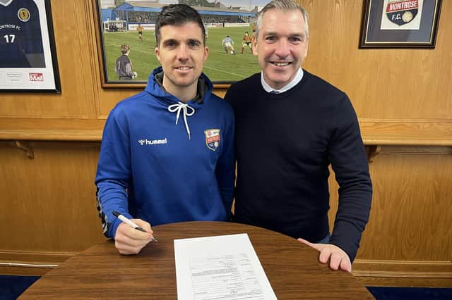 Terry Masson, left, signing a one-year contract extension with Montrose as manager Stewart Petrie looks on (Pic: Montrose FC)