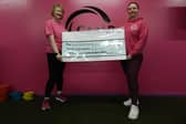 ​Kim McDonald (right) presents the cheque to Kathleen Blythe.