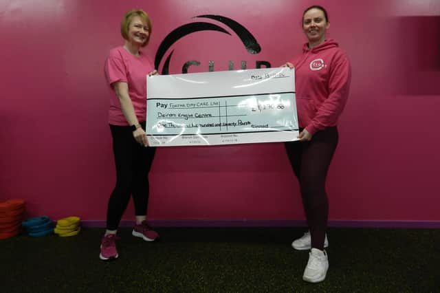 Kim McDonald (right) presents the cheque to Kathleen Blythe.