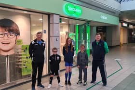 Pictured are David Durno, community trust trustee, members Harris, Kaydi and Carter and Jamie Buchan from Specsavers.