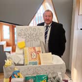 Angus MP Graeme Dey is delighted with the latest version of Scotland’s much cherished Baby Box.